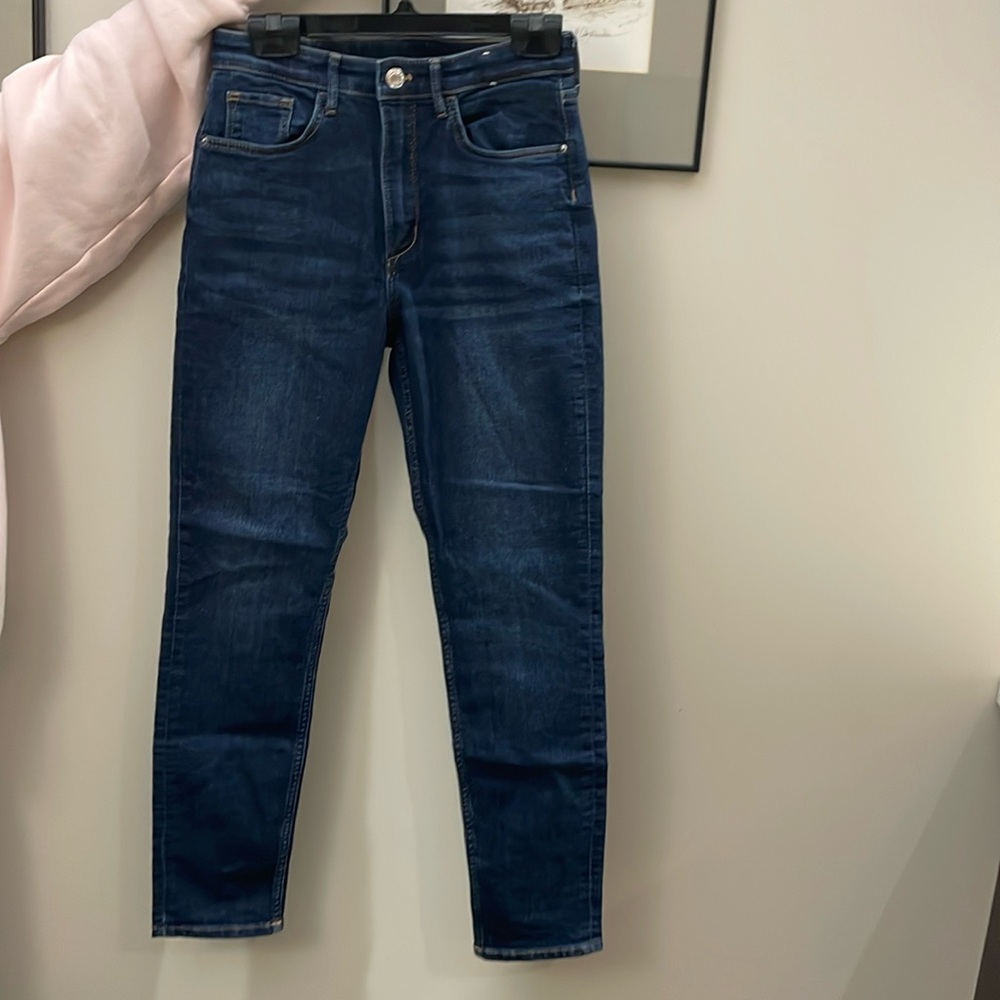 Dark blue denim. Barely worn. Looks brand new